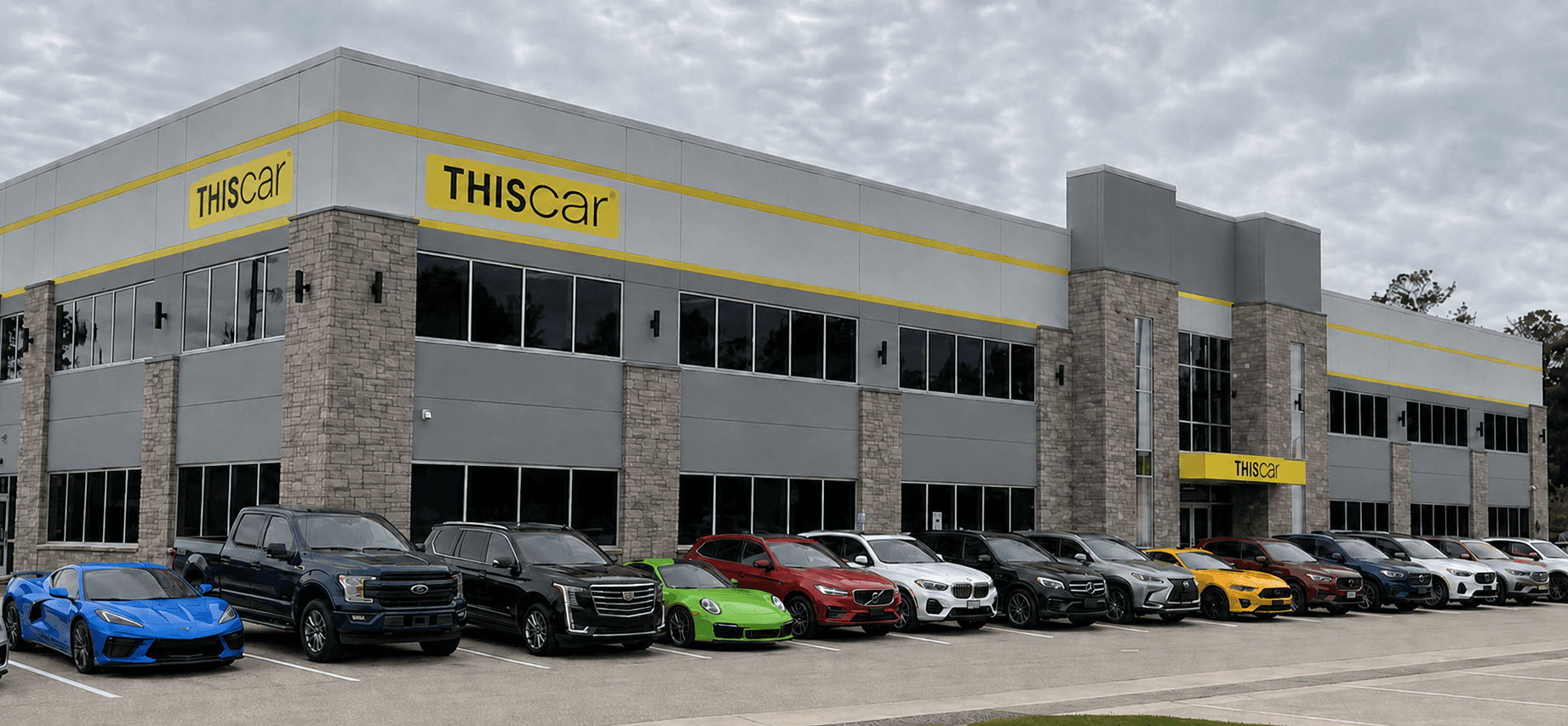 Used cars, trucks, and SUVs parked outside the THIScar building in Tomball, Texas